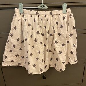 Girls’ Gap Kids white skirt with black stars, size 14/16